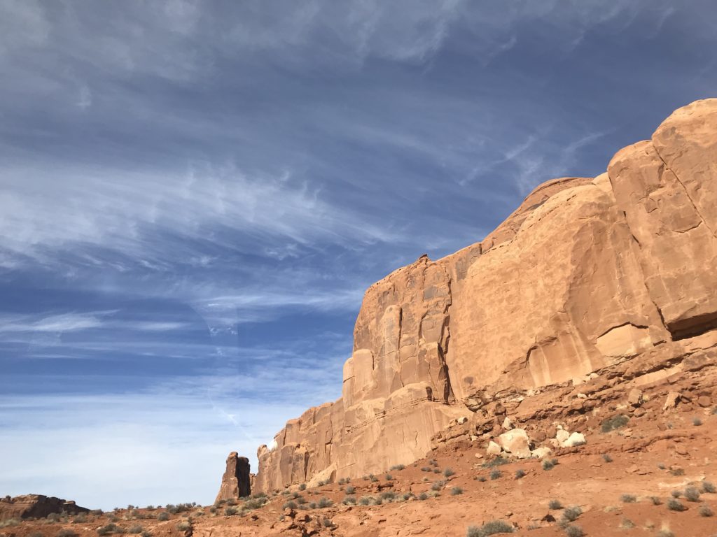 Beautiful Blue Sky with Red Rock Hillside in Moab, UT