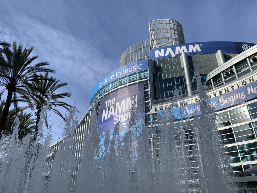 Anaheim Convention Center with Namm show signs as water feature